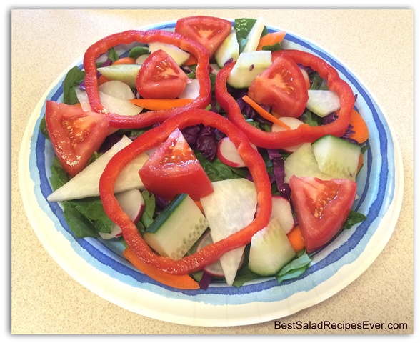 Layer of Tomatoes on Spinach Salad